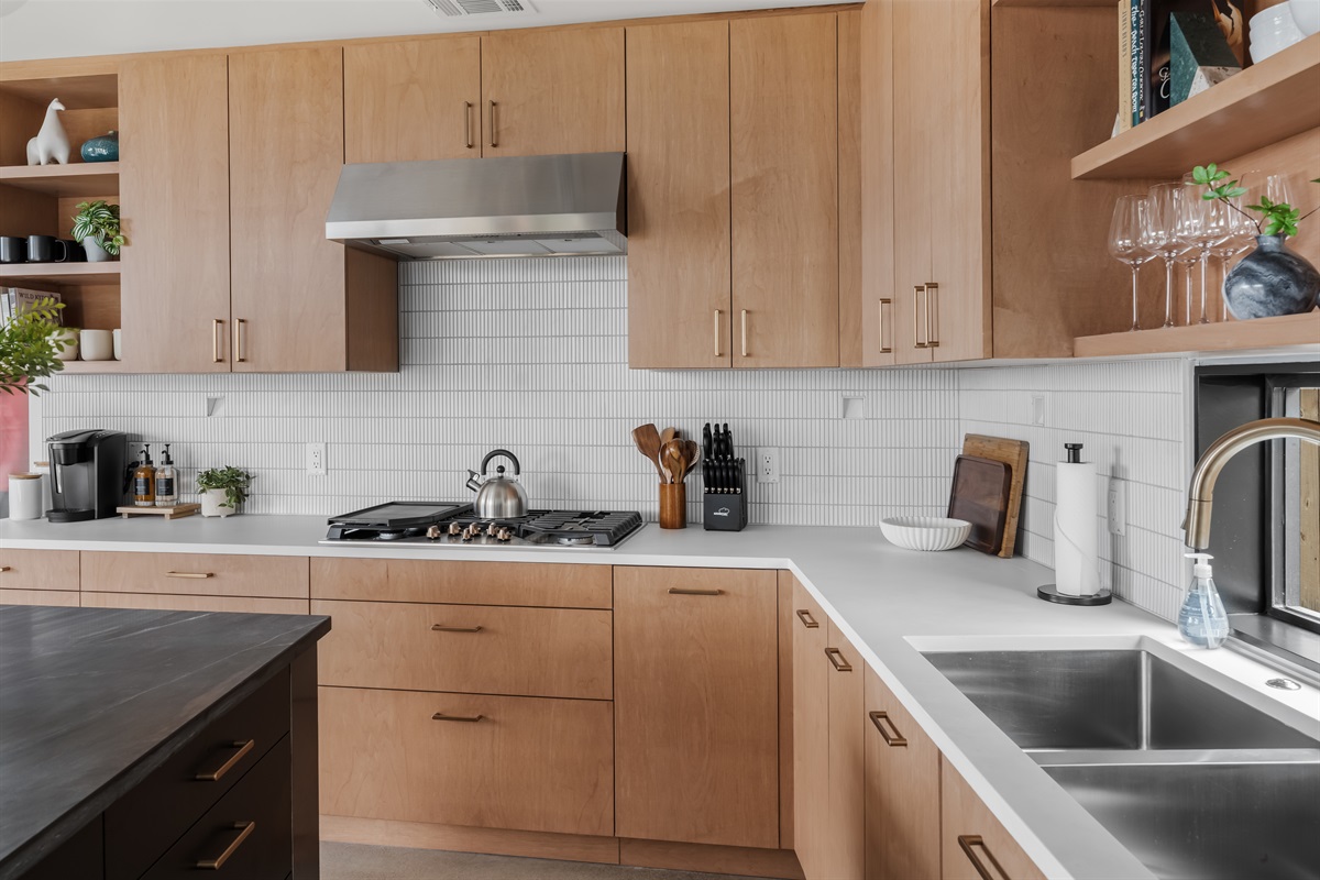 Sleek, fully equipped kitchen featuring clean lines, modern appliances, and everything you need to feel at home.