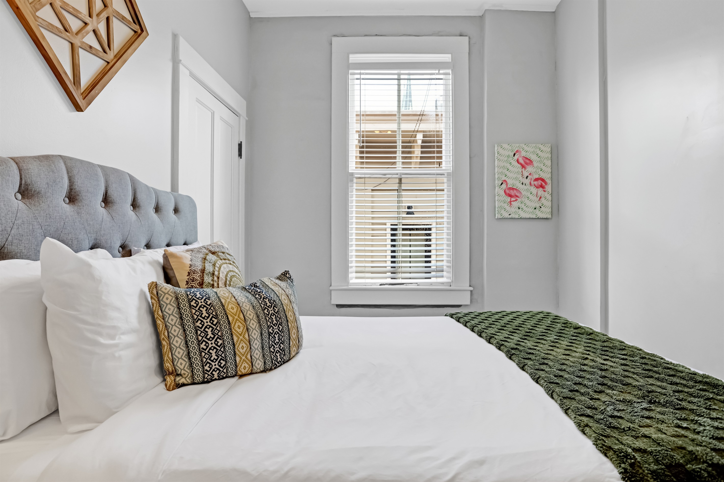Soft linens and bright windows create a peaceful retreat.