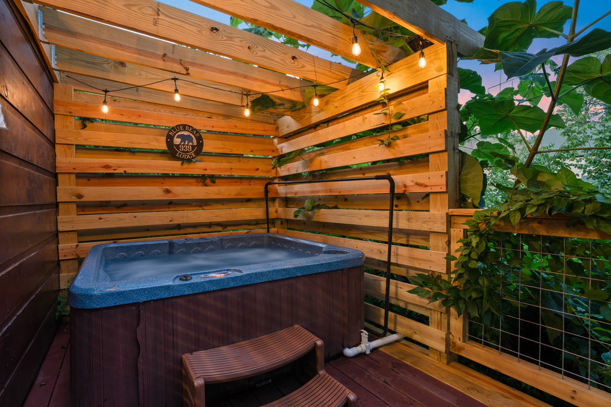 Enjoy relaxing in the hot tub with privacy screened pergola