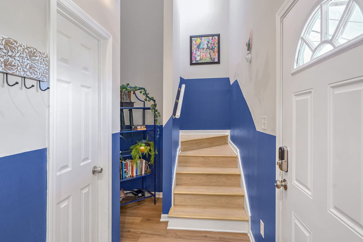 Internal access to downstairs or upstairs, each with a kitchen, living room, 3BR/2BA, & laundry!  This is where you will enter the house, greeted immediately by unique art and a place to leave your bags.  Ask about our free luggage storage!