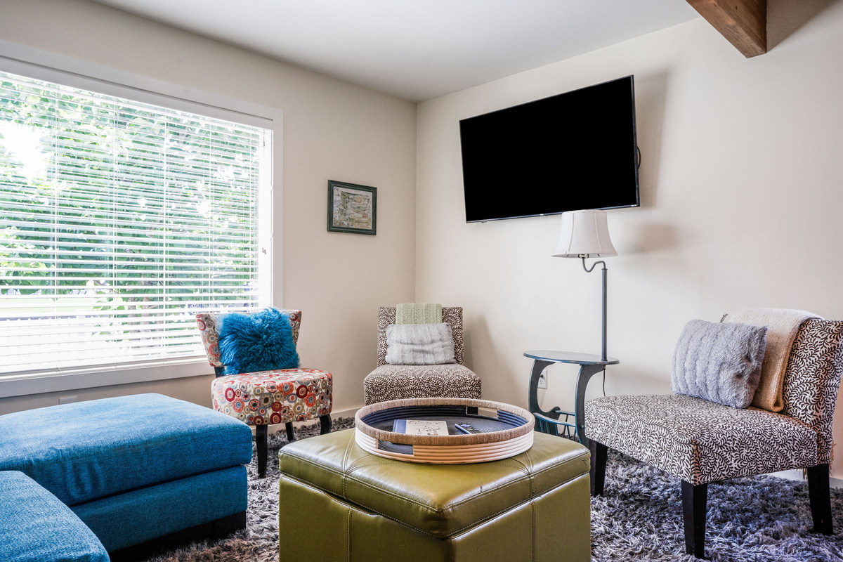 Comfortable couch and chairs for gathering in the living room. 