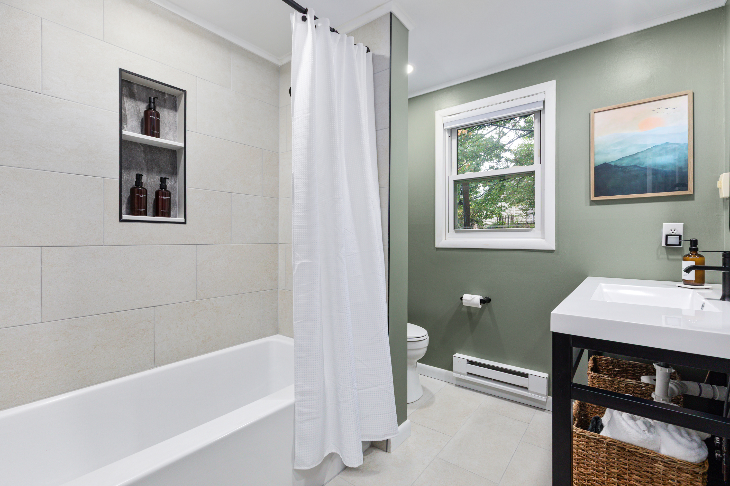 A full bath stocked with body wash, shampoo, and conditioner — everything you need for a relaxing soak or a quick refresh before heading out.