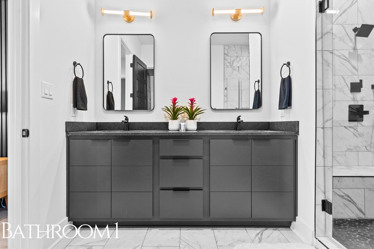 A spa-inspired bathroom with a sleek double vanity, minimalist finishes, and soft lighting that creates a calming and refreshing atmosphere.