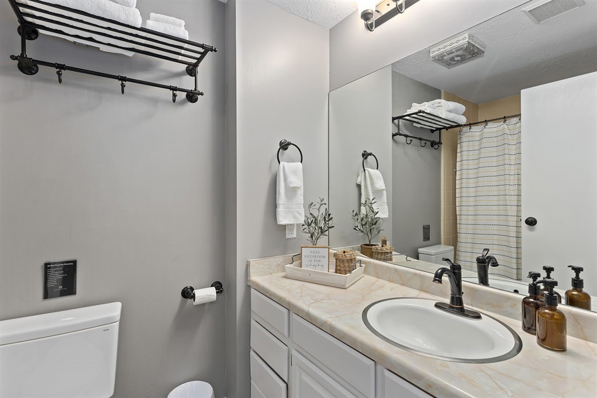 Upstairs bathroom with double vanity—great for getting ready as a group.