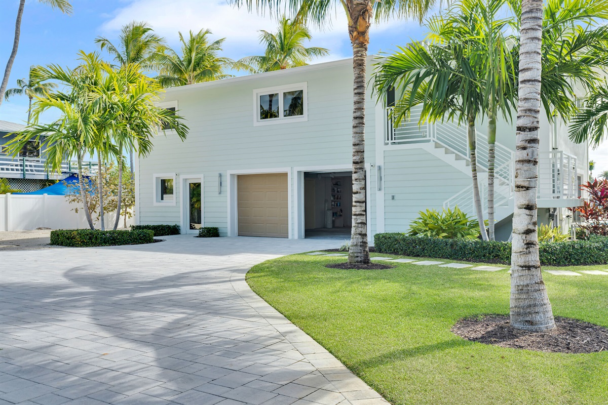Gorgeous landscaping with Christmas and Queen Palms throughout the property.