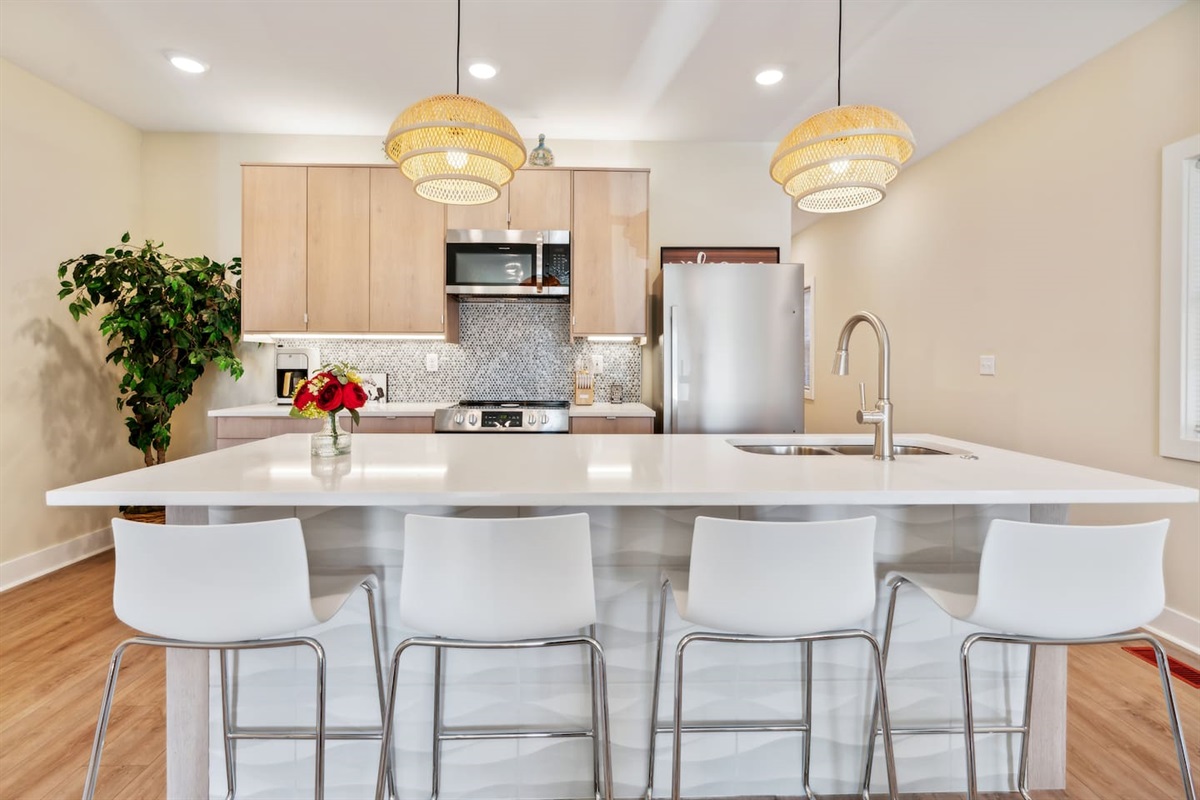 Gather around the kitchen island, watch TV, great space to prepare meals or surf the net. 