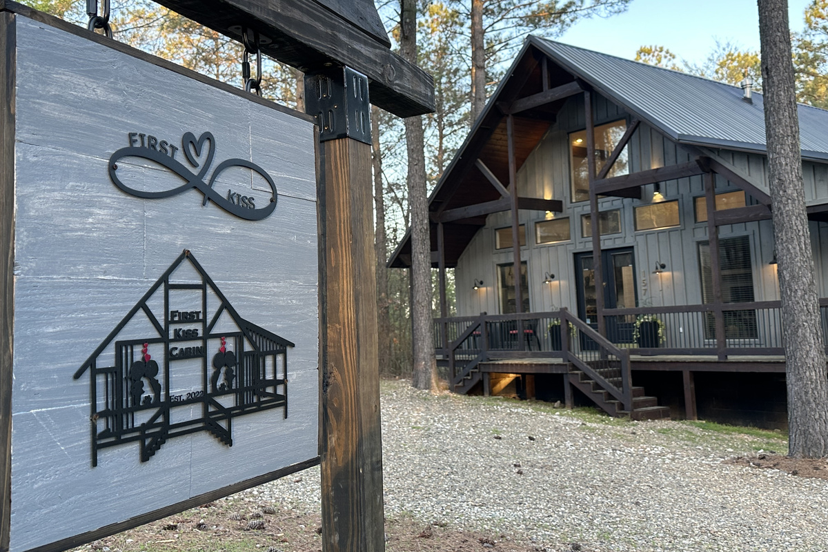 Our First Kiss cabin sign!