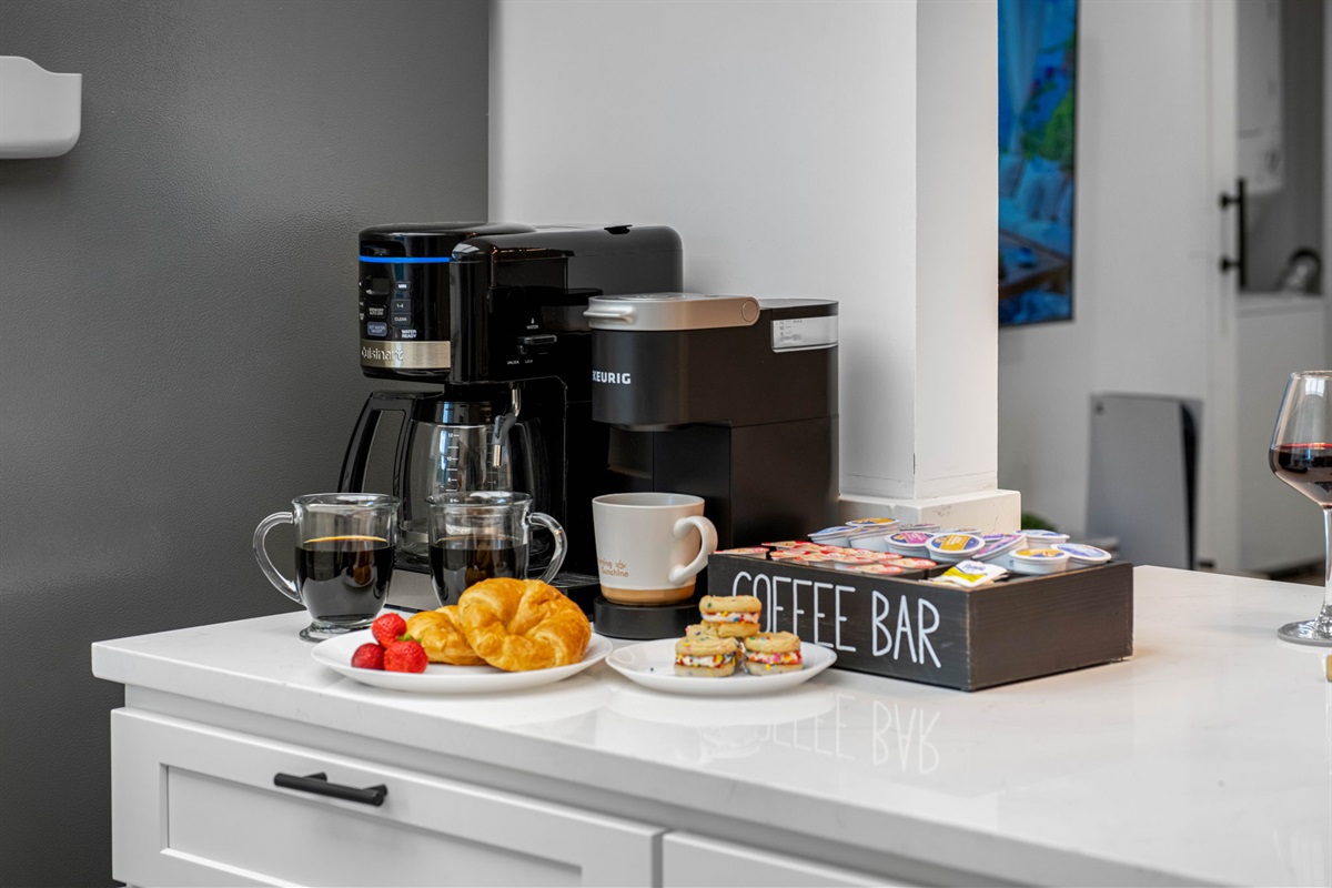 Start your day right with our deluxe coffee bar—complete with Keurig, drip machine, mugs, and K-cups.