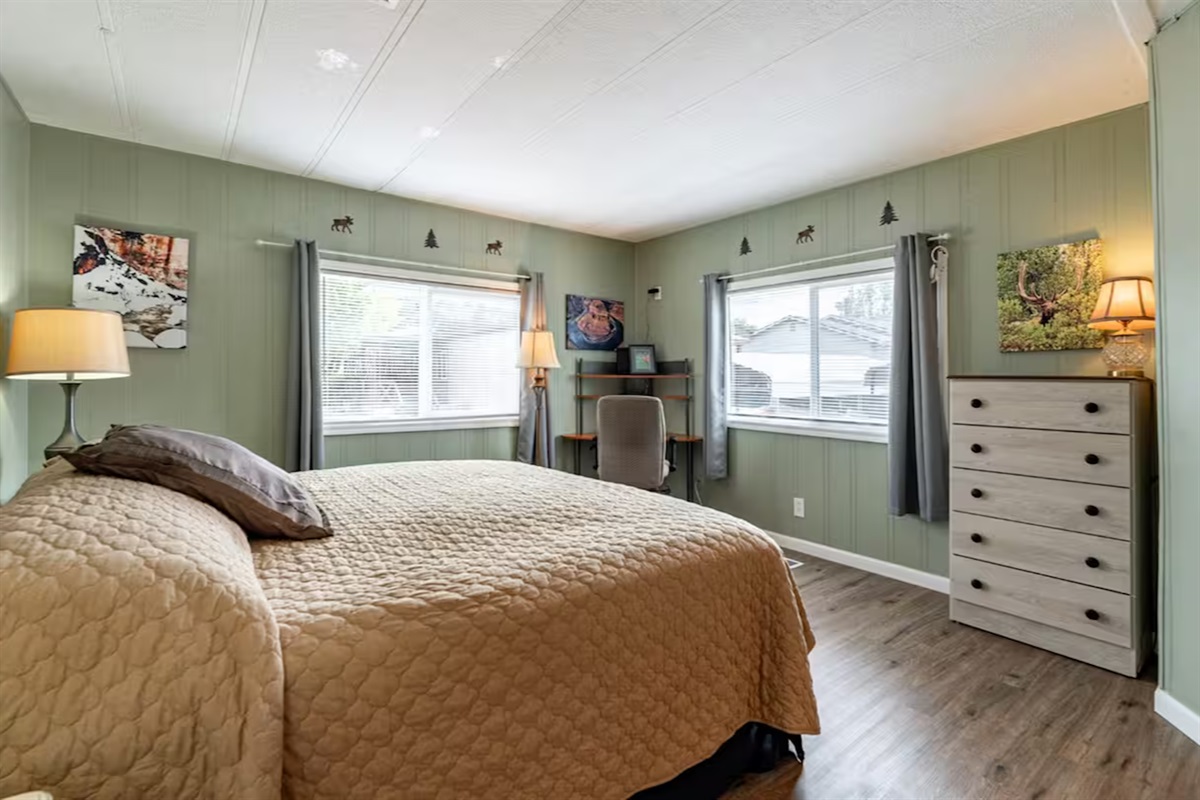 Bask in natural light, work at your private corner desk, and enjoy a spacious walk-in closet.