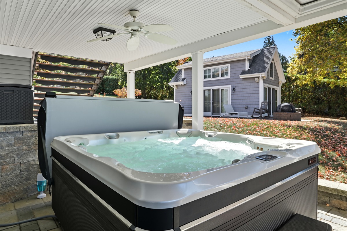 Unwind in the bubbling hot tub with views of the lake.