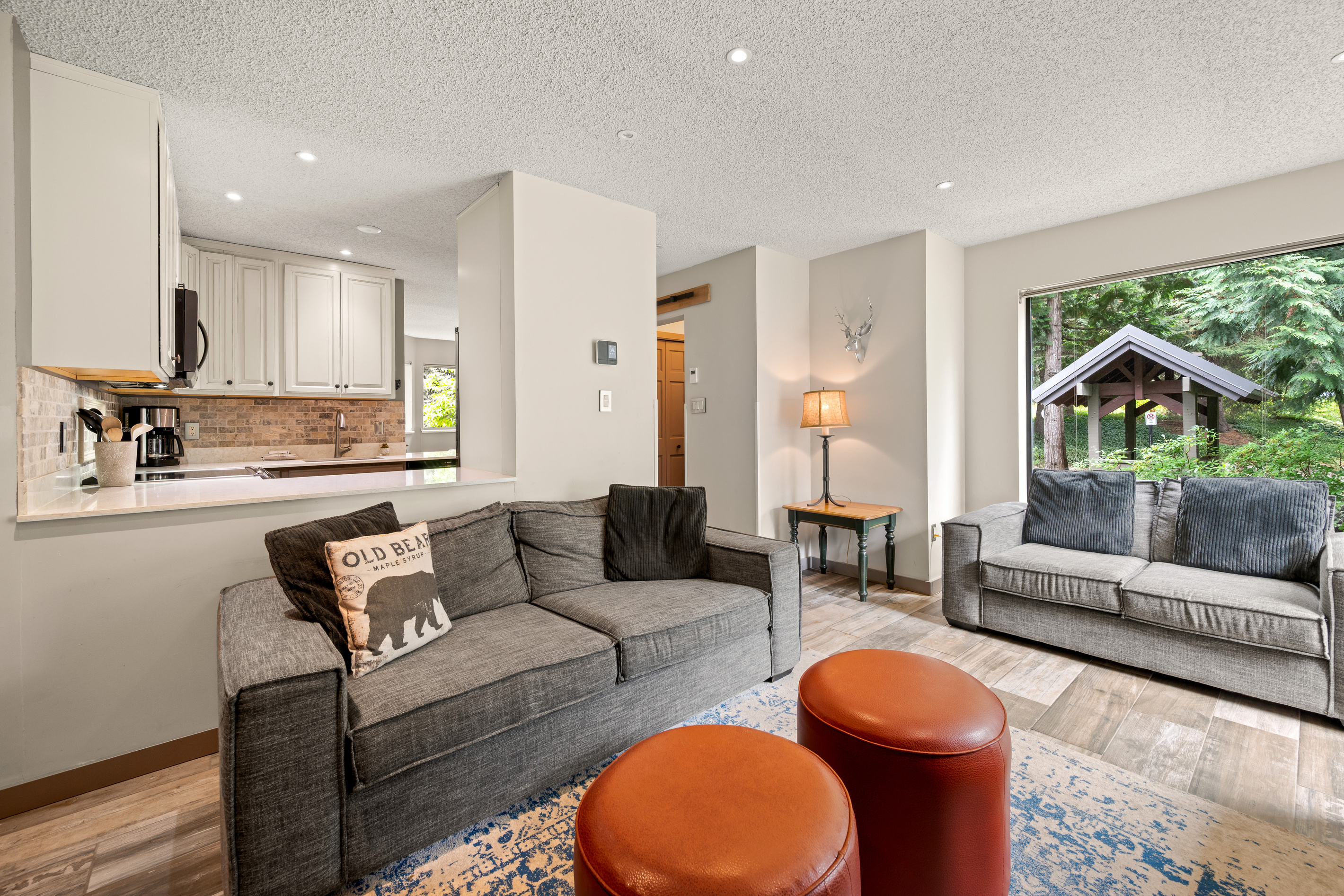 Open main floor: the living room flows into the kitchen and dining area, so the cook stays part of the conversation.