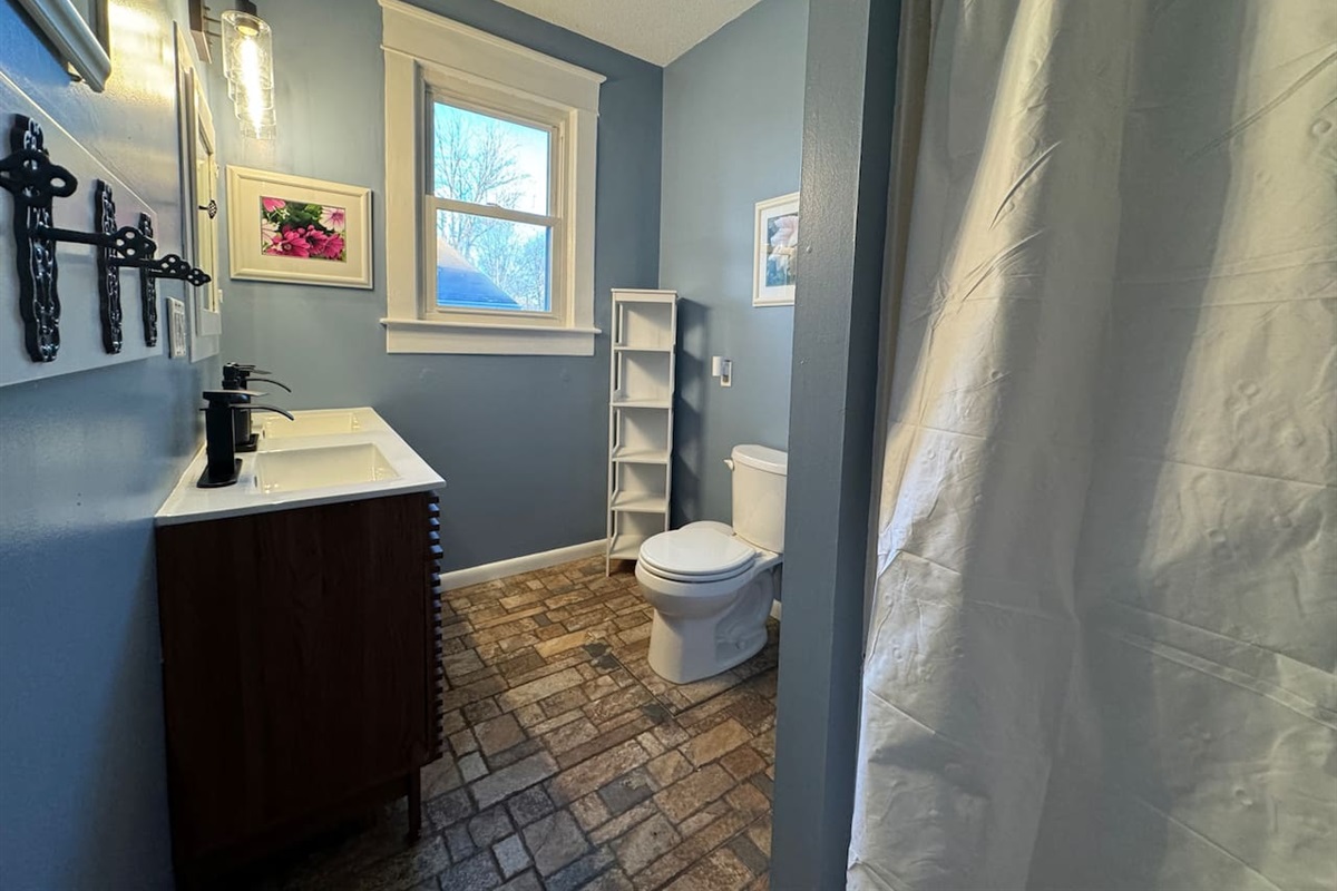 Upper Level Bathroom - Spacious double vanity and walk-in shower.