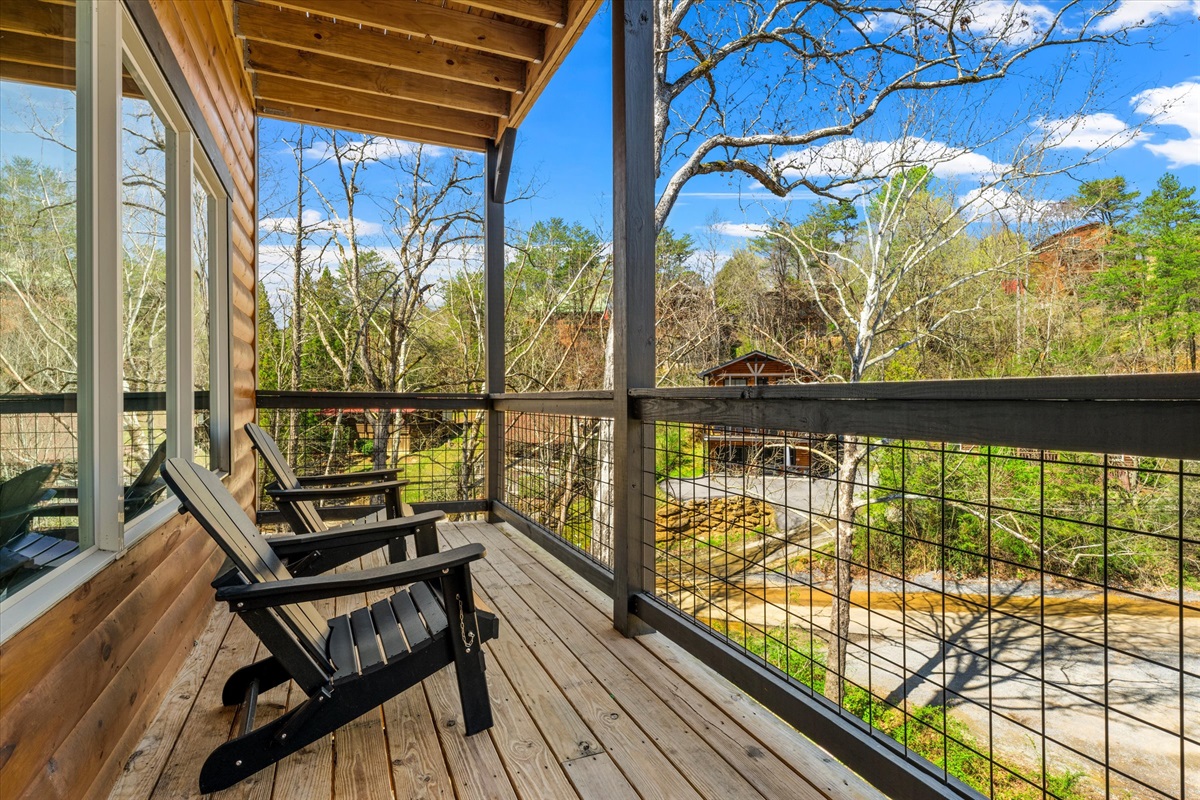 The open-plan living and kitchen area flows seamlessly onto a private balcony, perfect for enjoying your morning coffee in the fresh air.