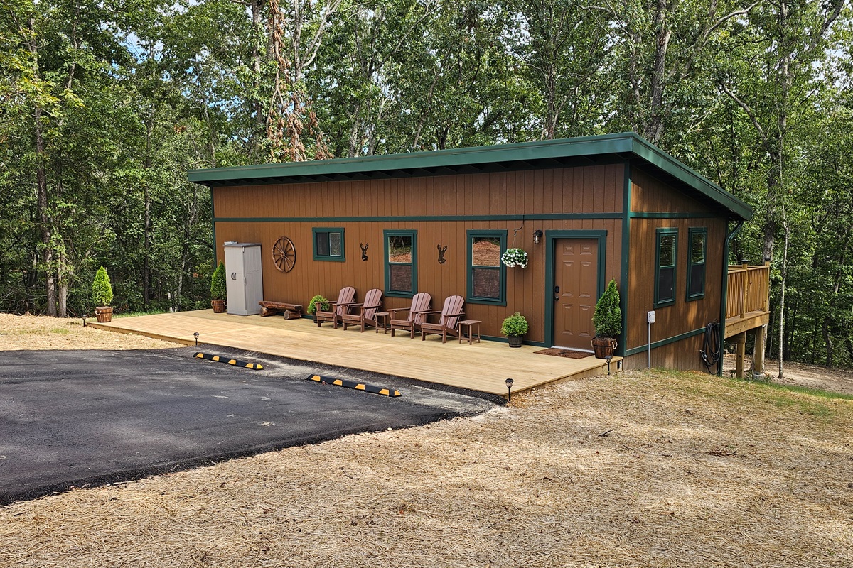 Welcome to your woodland getaway! Pull right up, grab a seat on the porch, and let the forest backdrop set the tone for a relaxing stay.