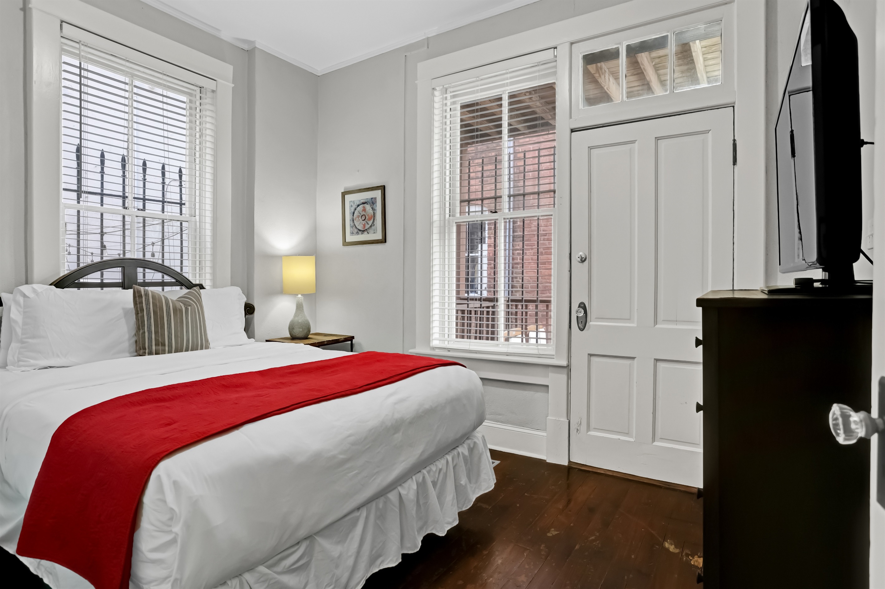 Comfortable queen bedroom designed for restful nights and bright mornings.