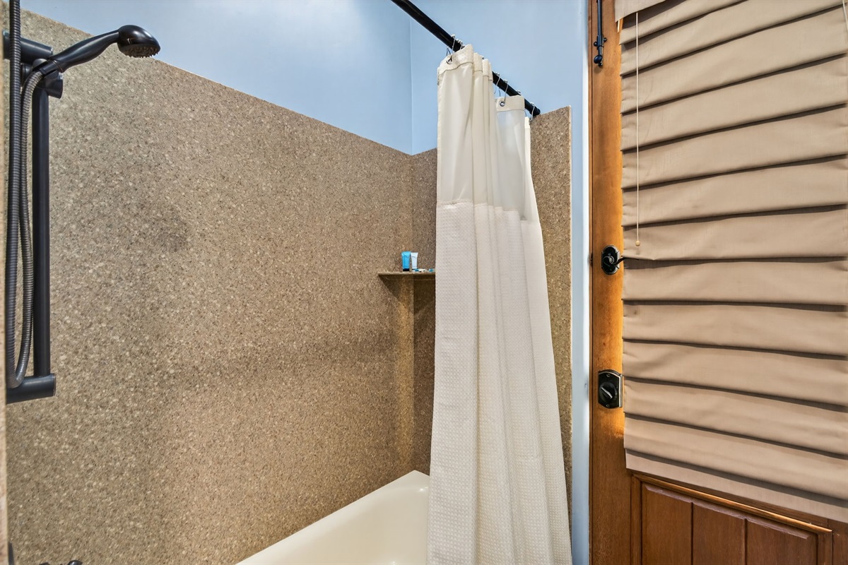 Additional first-floor shower bathroom provides extra convenience for larger groups and multi-family stays