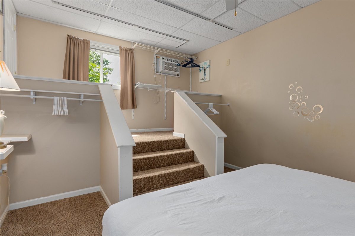 The bedroom is down a few steps from the main level of the condo.