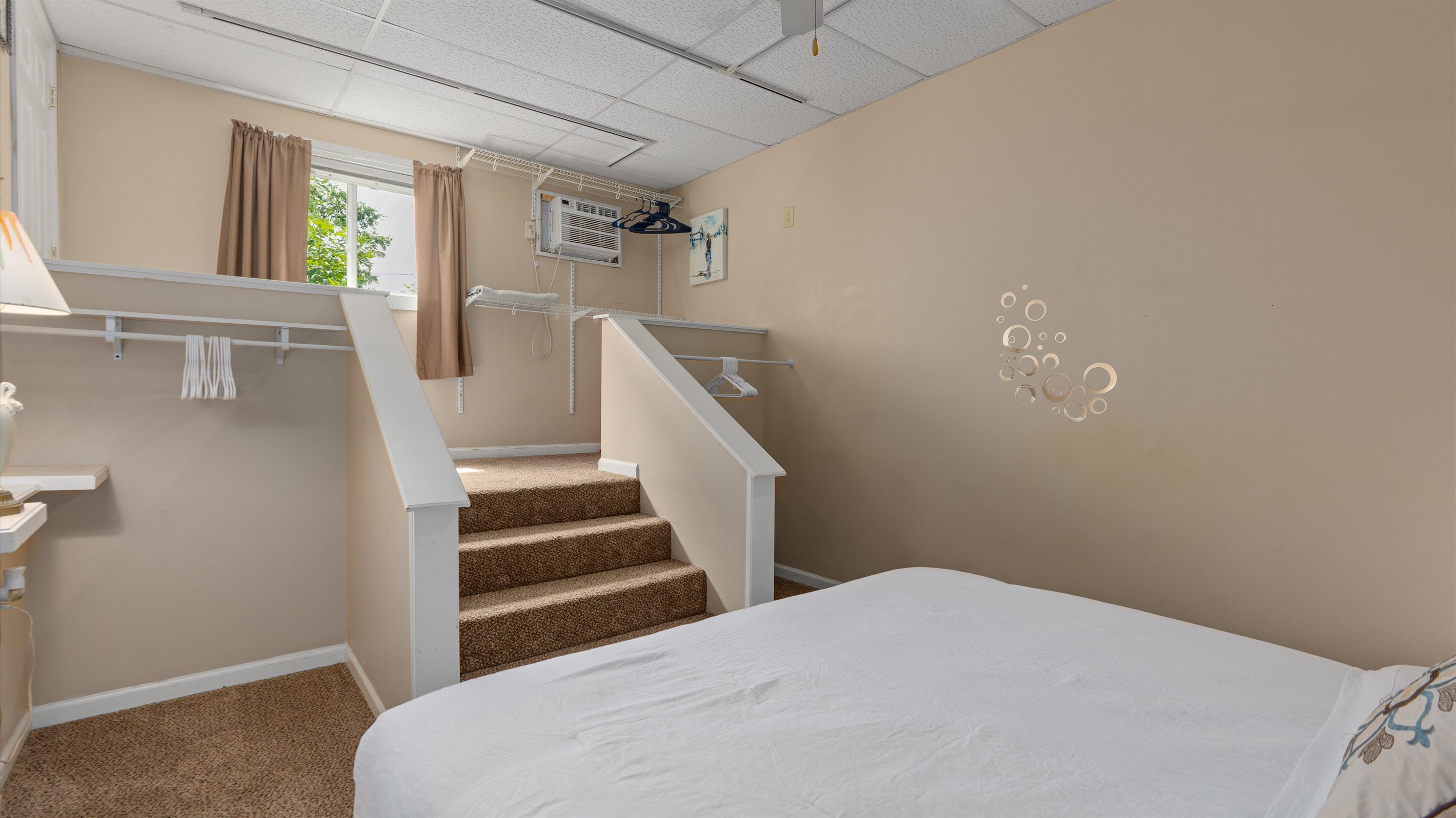 The bedroom is down a few steps from the main level of the condo.