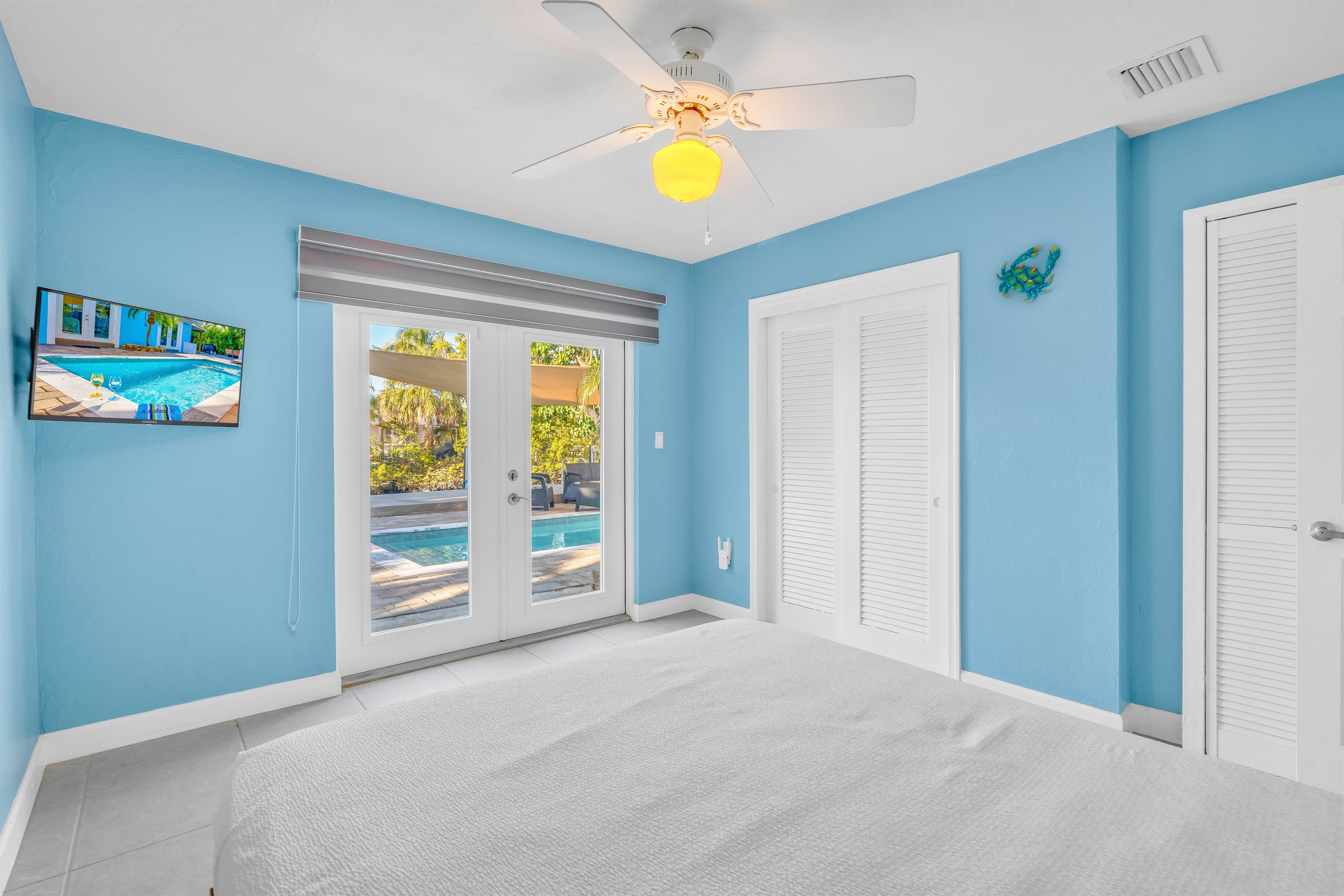The third bedroom has french doors opening out to the pool in back.