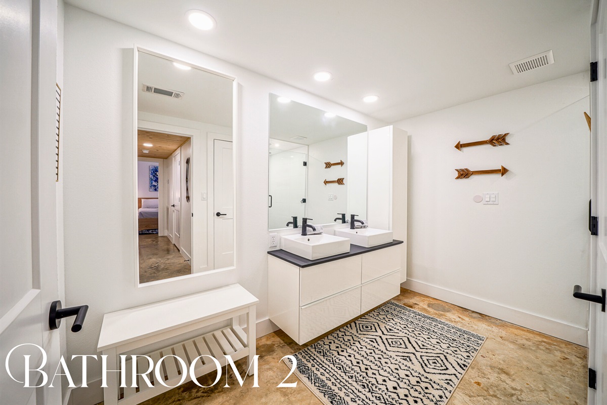 Bright, airy, and complete with a double vanity — this bathroom is ideal for couples or families sharing space with ease.