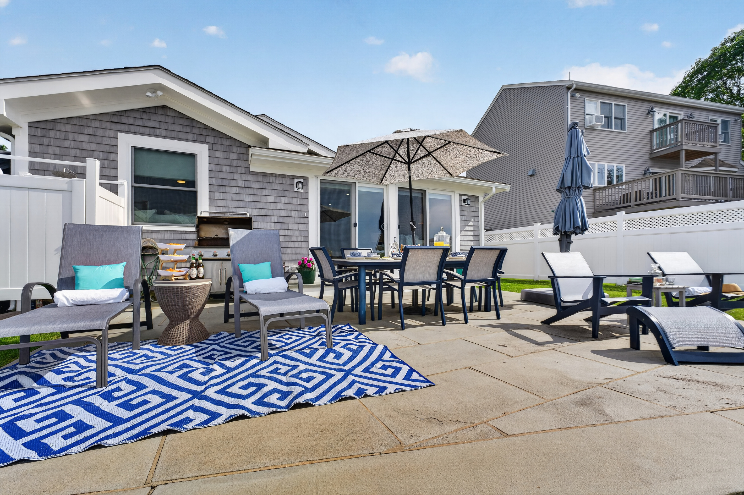 Spacious outdoor patio featuring dining, lounge seating, and plenty of room to gather.
