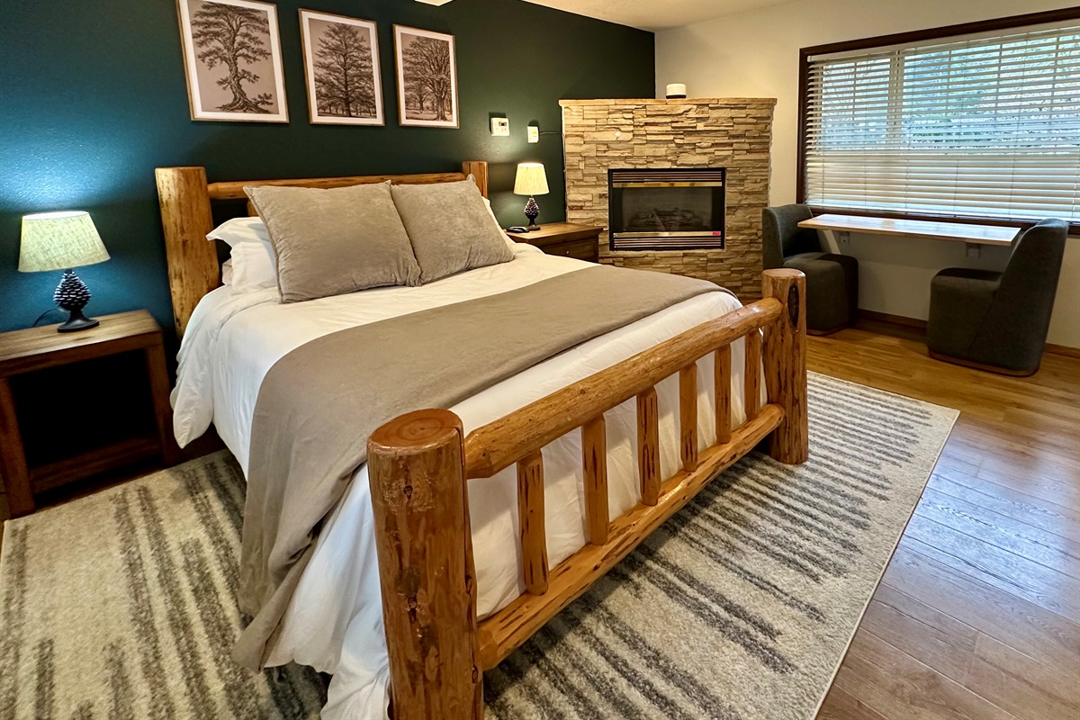 The barn offers a cozy log-framed queen bed, large windows and fireplace