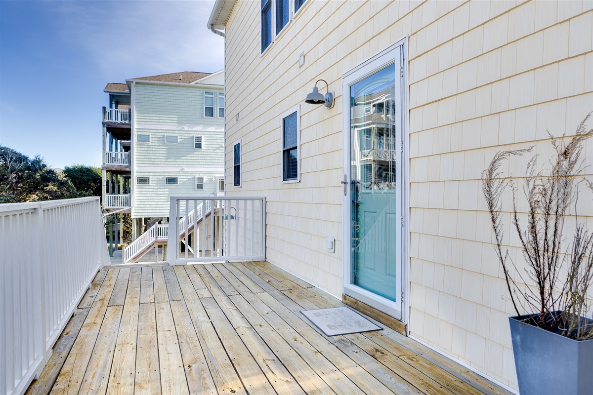Private deck entry with coastal charm: easy access, fresh air, and a perfect spot to kick off your beach day