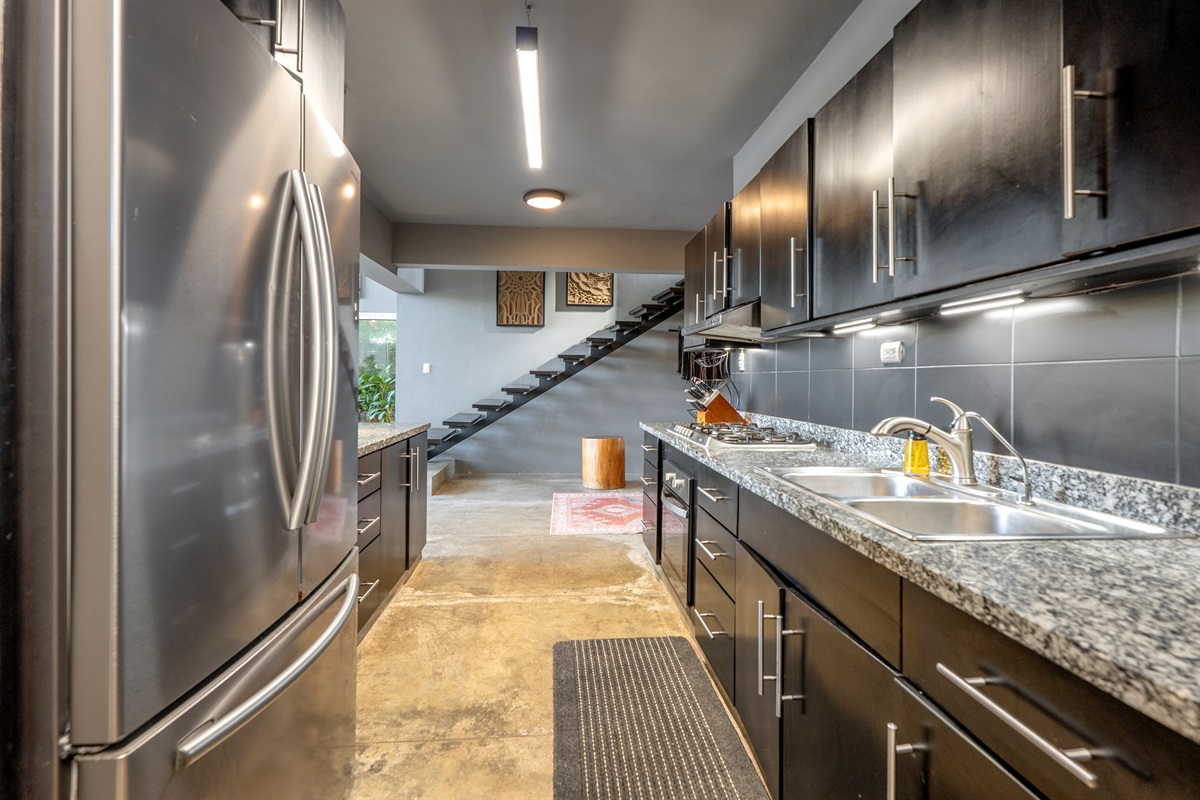 Clean kitchen with all the essentials ready to use.