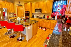 Spacious kitchen with elegant granite countertops, perfect for cooking and entertaining