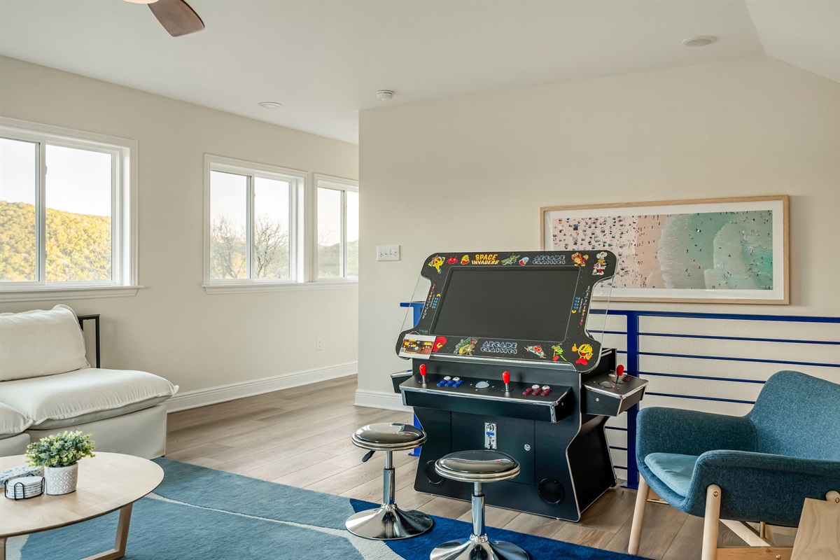 Arcade game corner in the upstairs loft — fun for guests of all ages.