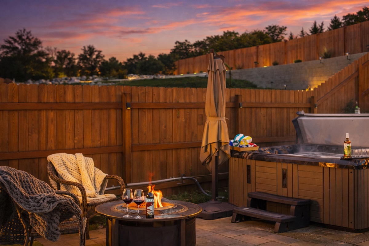 Backyard summer evening oasis with 6-7 person hot tub and solo stove fire pit