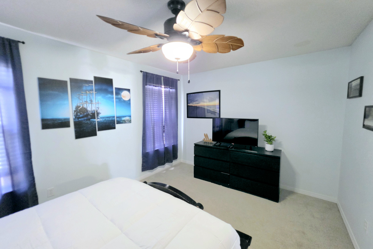 Bedroom with TV and dresser