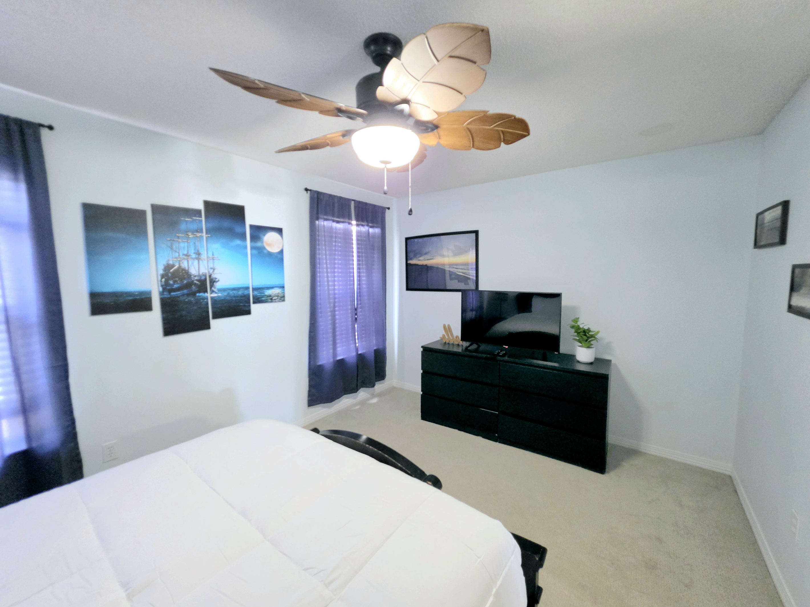 Bedroom with TV and dresser
