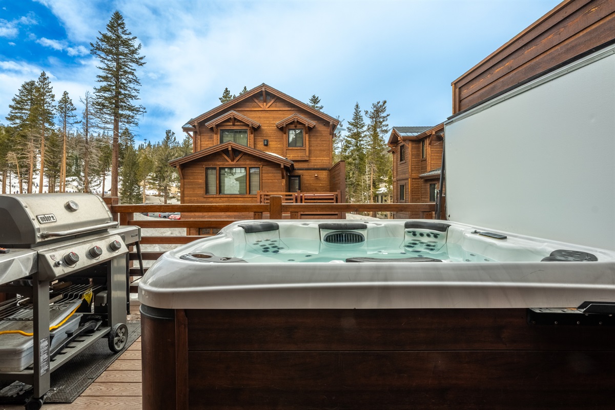 Après done right—your private slopeside balcony with hot tub, grill, and front-row views of Canyon Lodge and the mountain beyond.