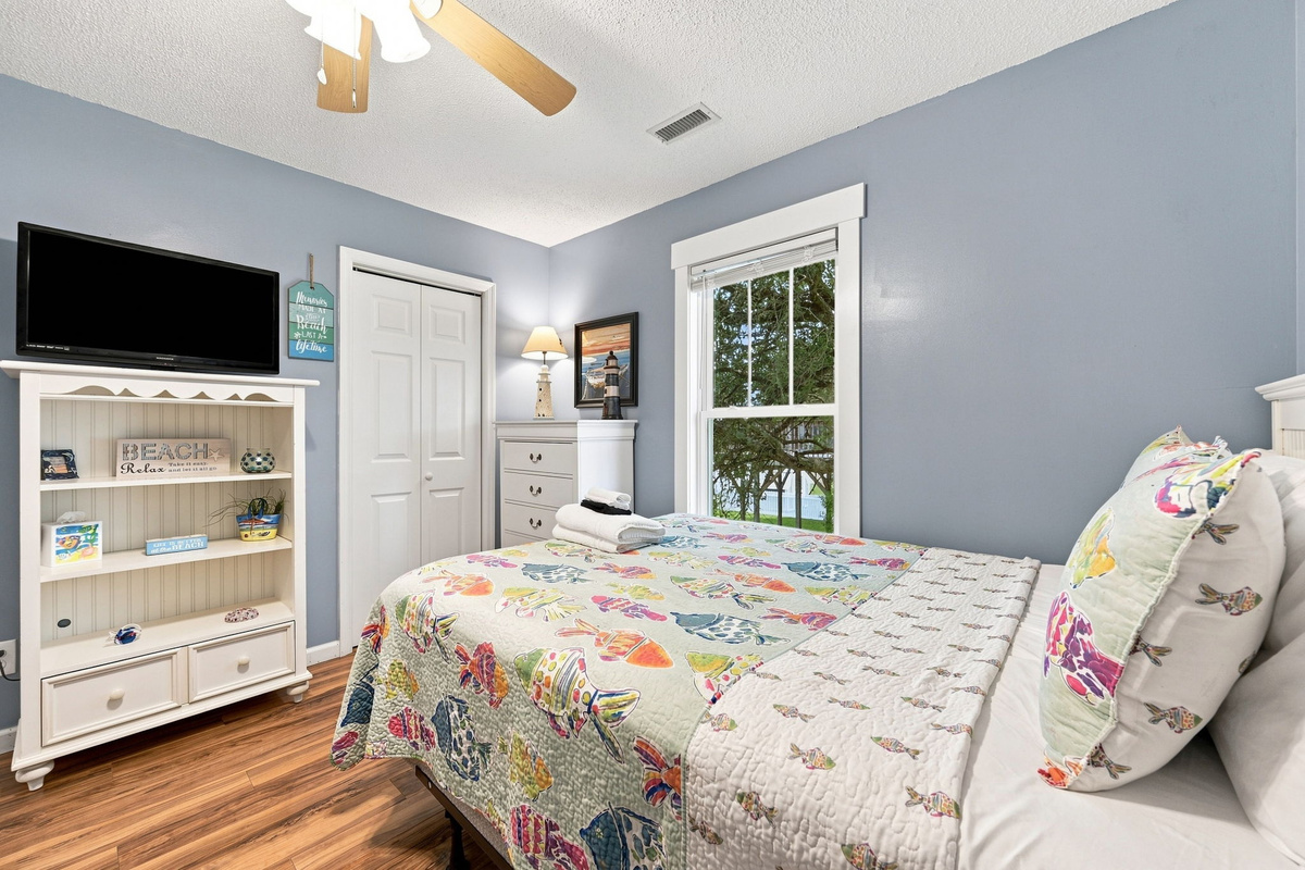 This inviting bedroom offers a queen bed, Smart TV, and ample storage for a comfortable stay