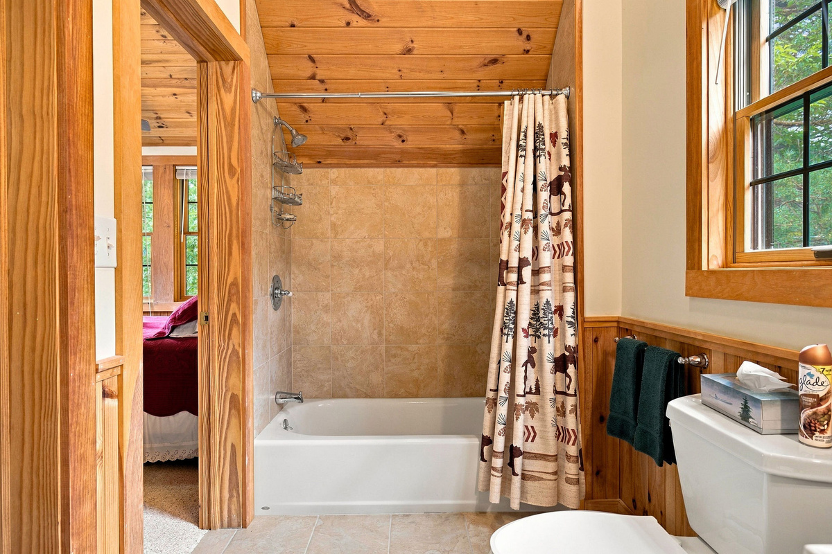 A full bathroom with a tub-and-shower combination is conveniently located between the two upstairs bedrooms.