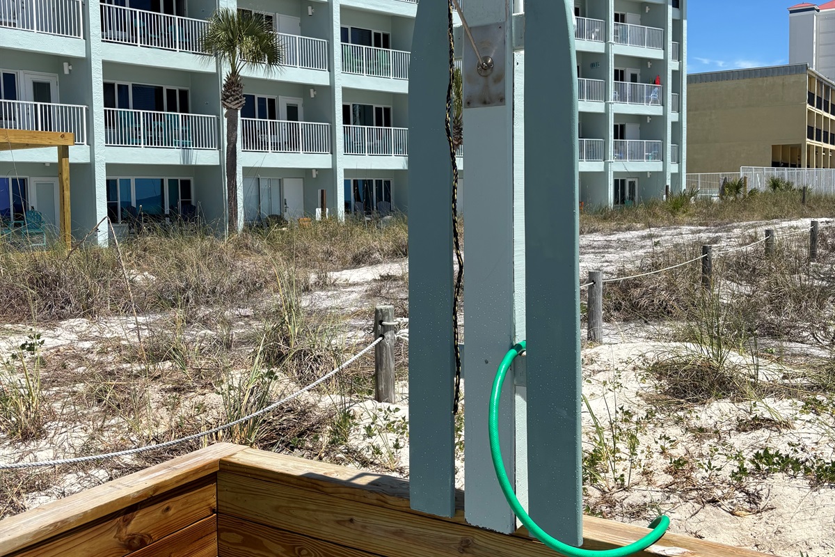 Washy! Washy! all that sand off before entering the condo.