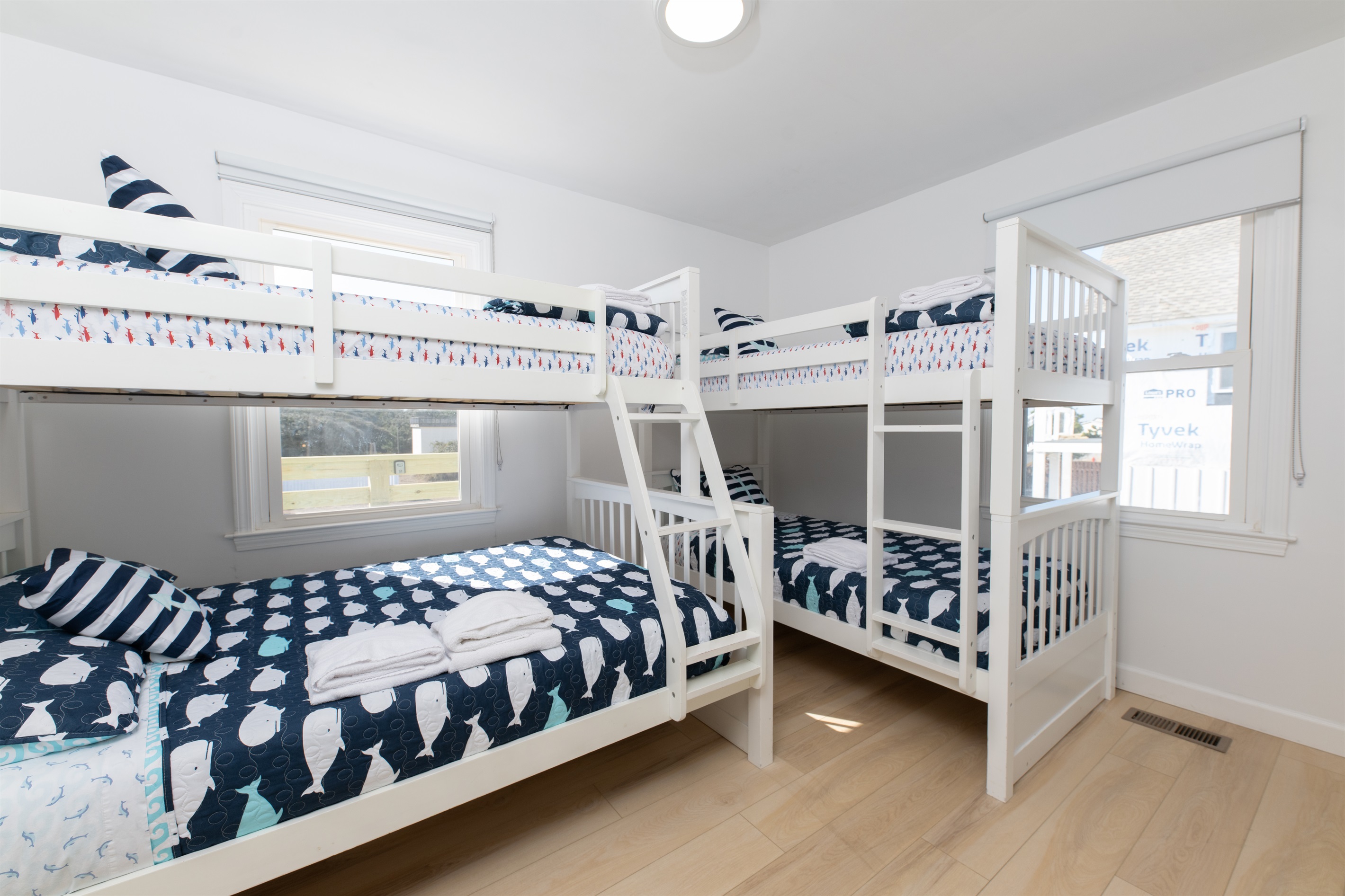 Double bunks with 100% cotton sheets and blackout curtains so the kids can sleep in too.