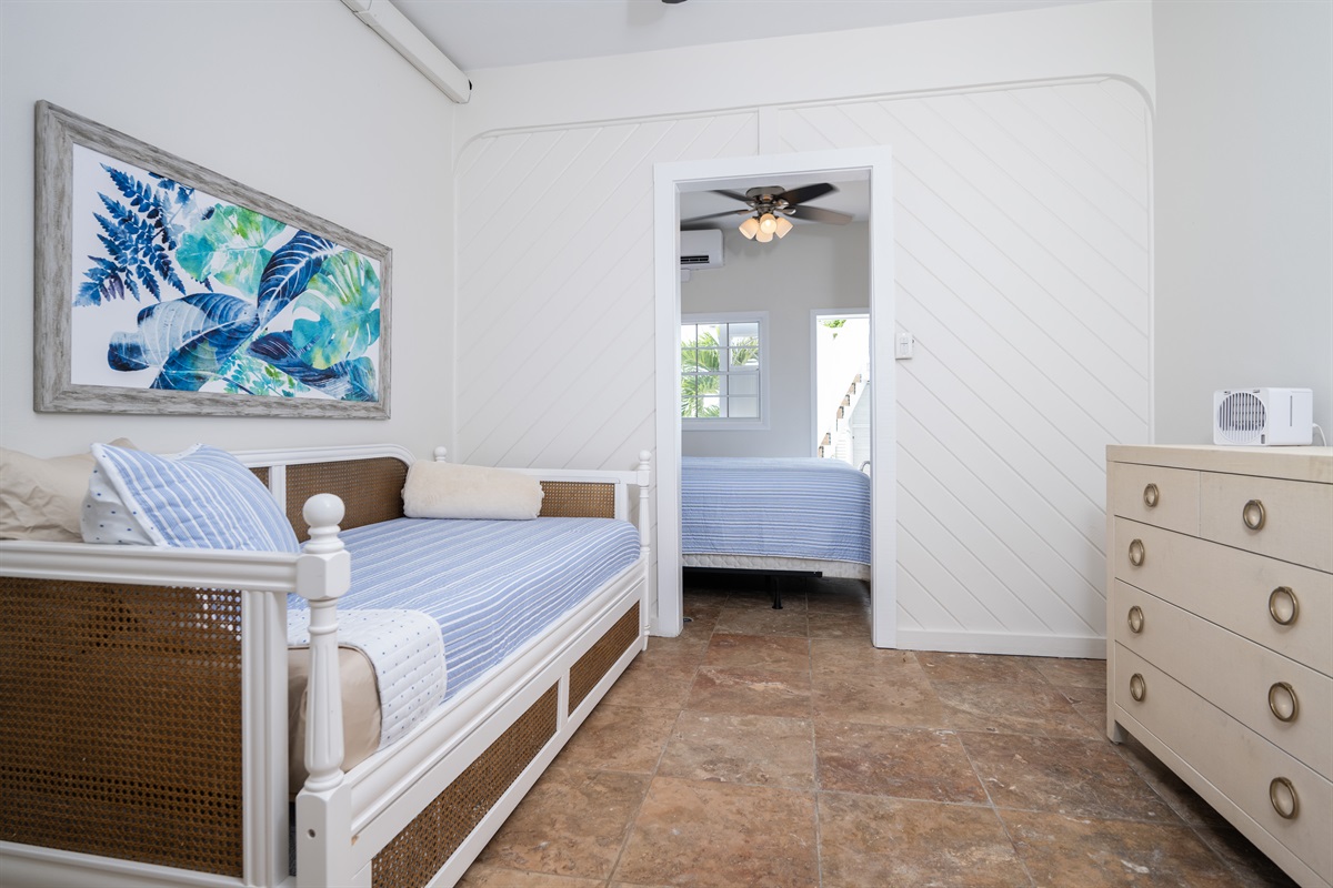 Pool Bedroom 2: twin trundle bed that shares a space with the king bed in the adjoining room