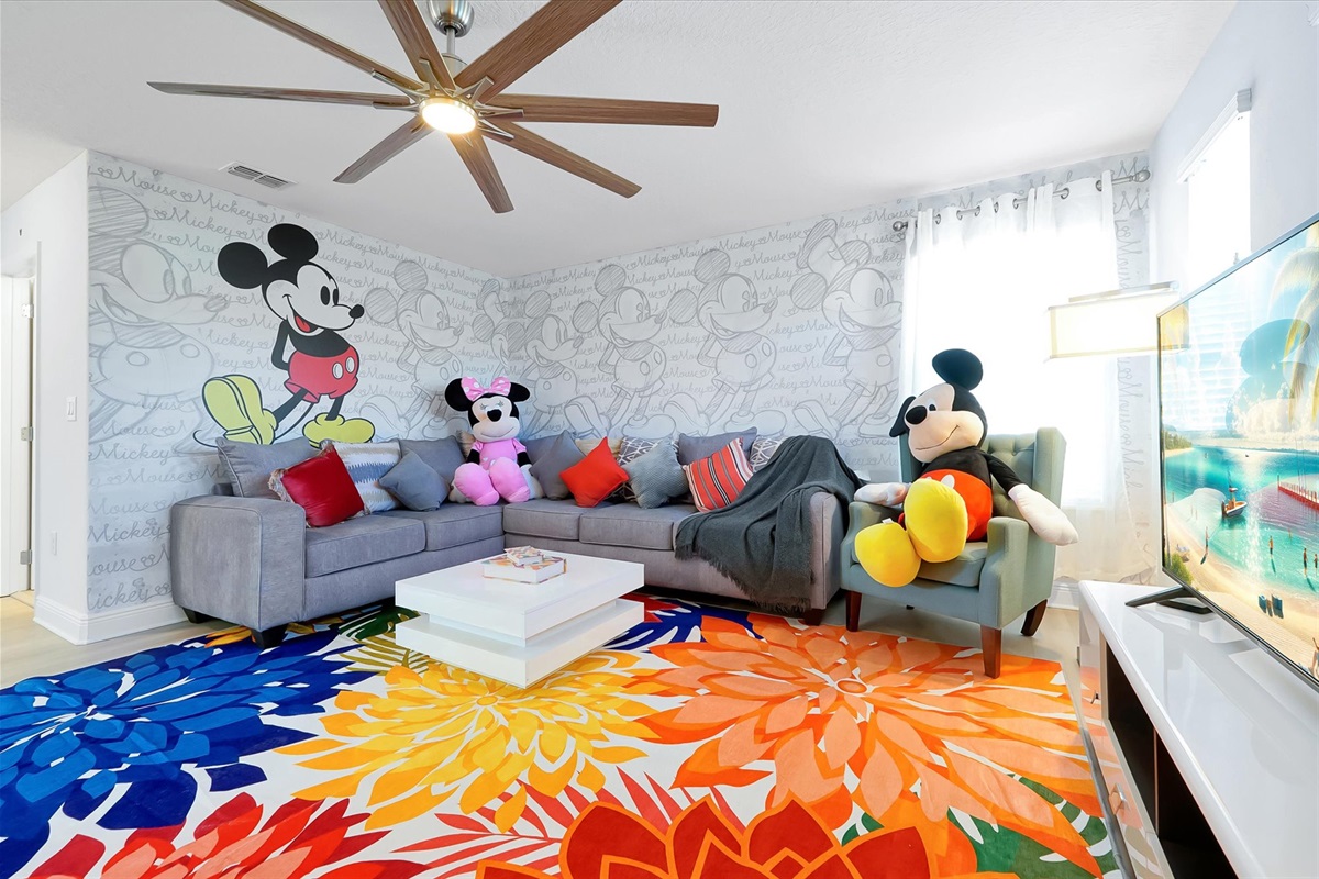 The upstairs living room is a cozy spot to relax after a day in the Florida sun.