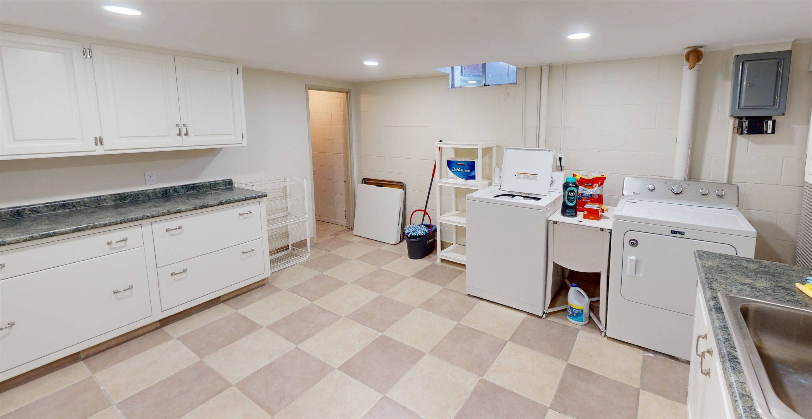 Laundry Room with storage in multiple cabinets 