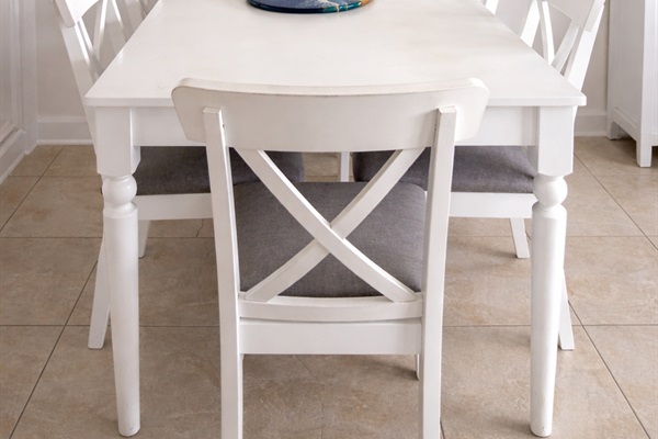 Bright coastal dining area with seating for six