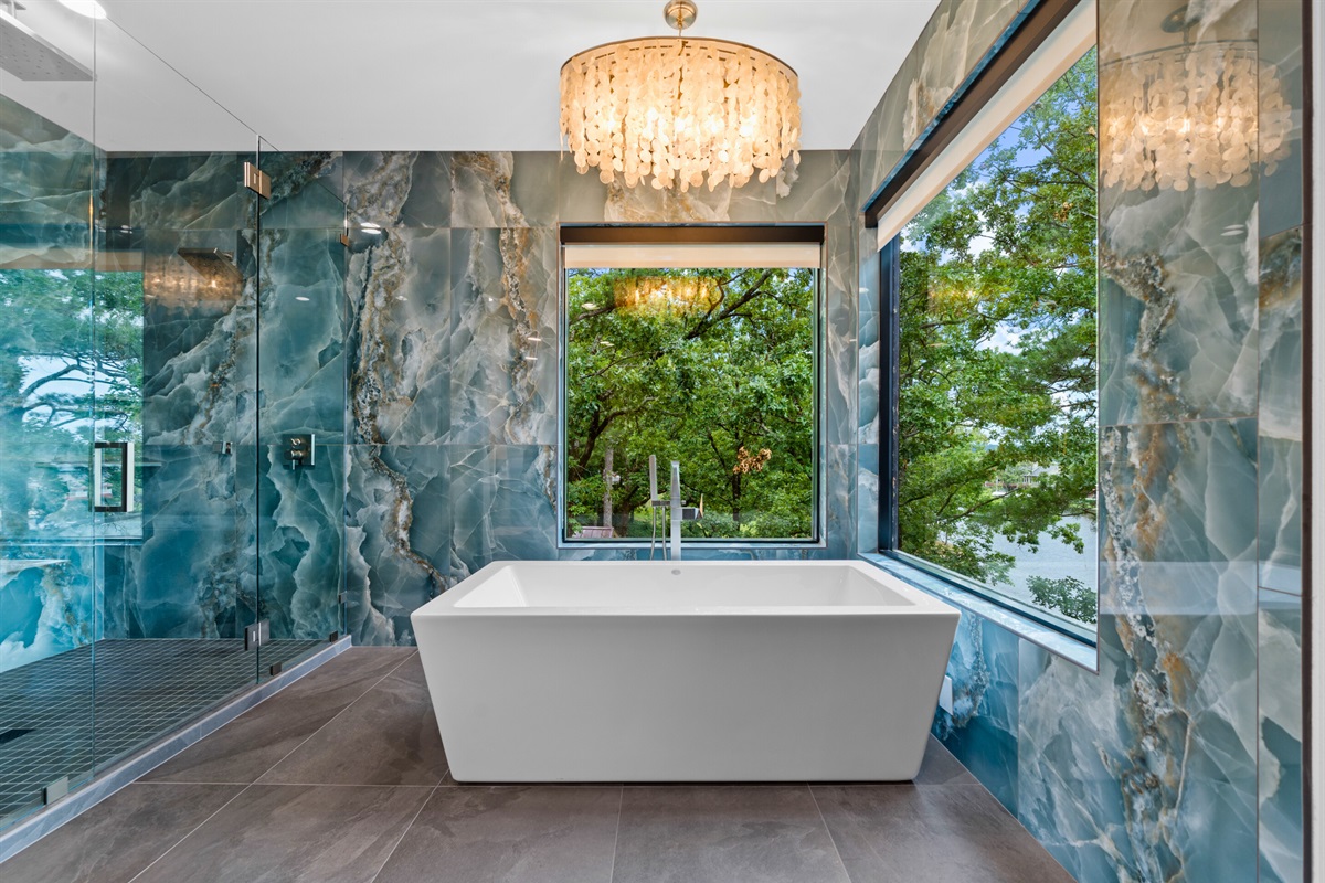 Step into this serene bathroom oasis, where every bath feels like a luxurious escape. The perfect place to unwind after a long day.