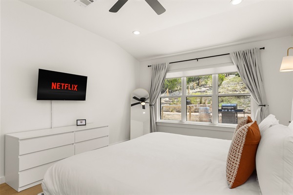 Rest easy in our cozy bedroom both blinds and blackout curtains provided.