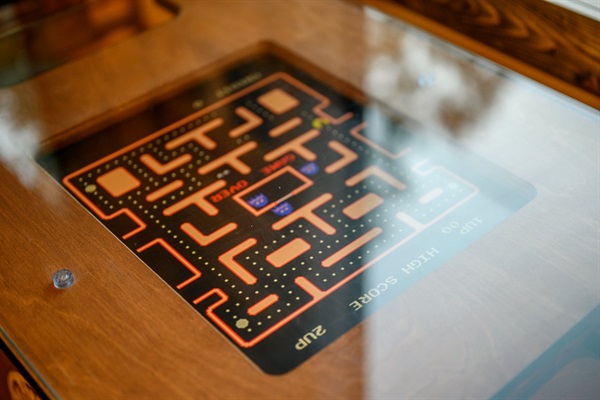 Vintage-style cocktail arcade table for late-night cabin competitions.