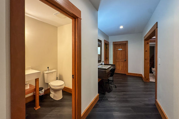 Downstairs half bath near the game room and theater.