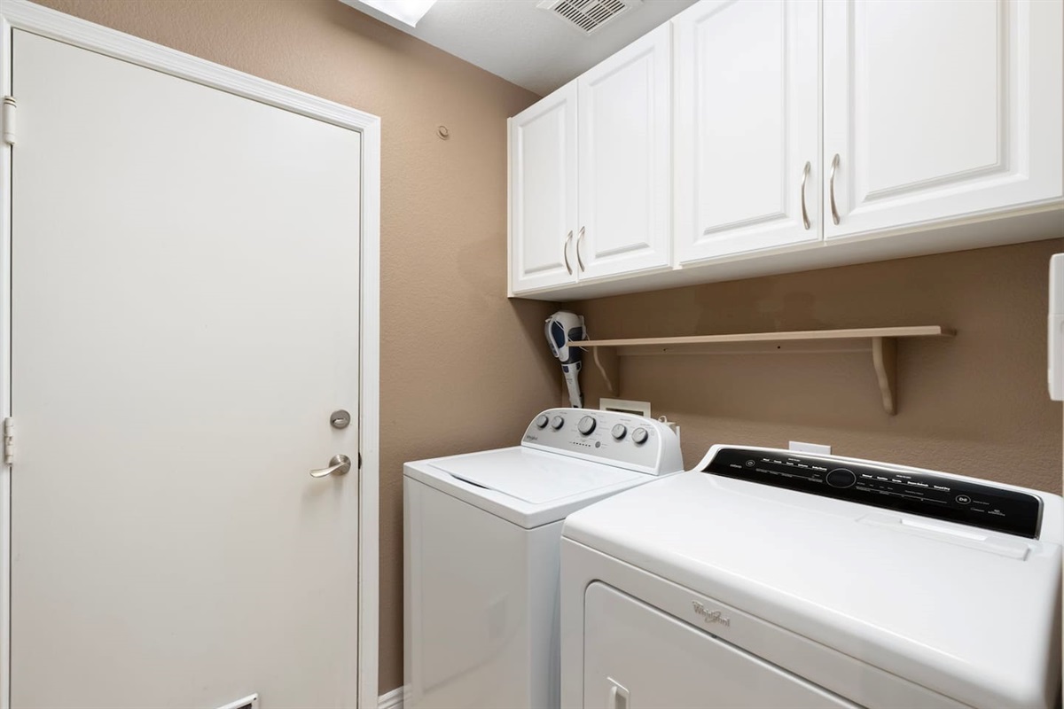 A full-size washer and dryer with overhead cabinet storage means you can pack lighter and leave fresher — no laundromat runs needed during your stay.