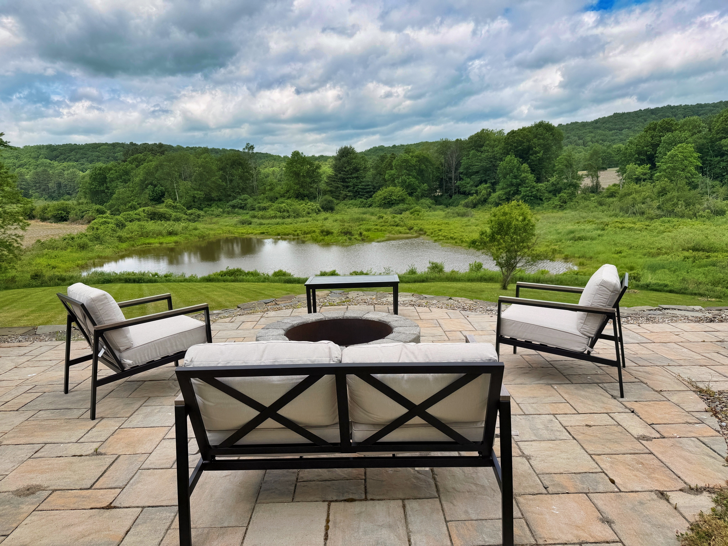 Outside seating around the wood burning fire pit the views are spectacular.