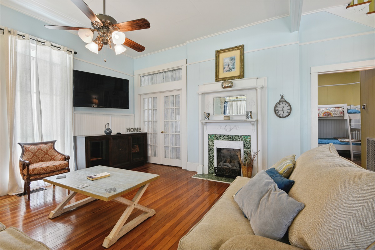 Living room, big screen smart tv. French doors to master bedroom suite.