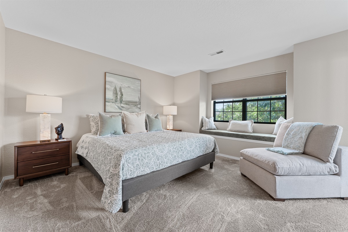 🛌 Retreat to the luxurious king primary suite with spa-inspired lighting, soft neutral tones, and seating perfect for unwinding.